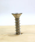 Number Twelve By One Inch Stainless Steel Wood Screws Flat Head Phillips Drive 304 Grade Rust Resistant Decking Fasteners built into wood surface.