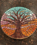 Colorful mosaic Tree of Life design on fifteen inch handcrafted glass lazy Susan rotating tray for dining table.