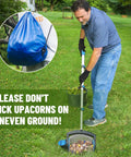 Person using Nut Gatherer Picker Upper For Acorns Pecans Buckeyes Hickory Nuts And More With Side Opening Dump on grass.