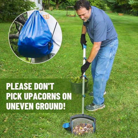 Person using Nut Gatherer Picker Upper For Acorns Pecans Buckeyes Hickory Nuts And More With Side Opening Dump on grass.
