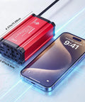 Heavy Duty 300 Watt Car Power Inverter, Plug And Play Dc 12v To 110v Ac Conversion With Dual Usb Fast Charging and US House Plugs, displayed beside a smartphone.