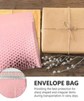 Rose Color Air Bubble Mailers Padded Envelopes Self Seal 25x20cm with package and twig on wooden surface