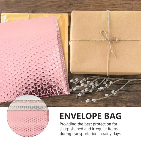 Rose Color Air Bubble Mailers Padded Envelopes Self Seal 25x20cm with package and twig on wooden surface