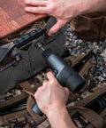 Using Cordless Brushless Drill Kit 12V With LED Digital Display to assemble metal hinge on outdoor surface, showing hand grip