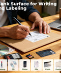 Person writing on Rigid Kraft Mailers 6x9 Inches Pack 50 Eco Friendly Recyclable Mailers With Corrugated Inside Padded Self Seal Envelopes.
