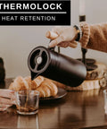 40 Oz Thermal Coffee Carafe With Tea Infuser Stainless Steel Double Walled Vacuum Insulated Beverage Dispenser in use at table