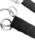 Close-up of rings and wrapped handles on Dual Stainless Steel Shaolin Double Dagger Set for Martial Arts Practice and Daily Training.