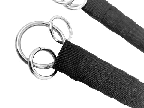 Close-up of rings and wrapped handles on Dual Stainless Steel Shaolin Double Dagger Set for Martial Arts Practice and Daily Training.