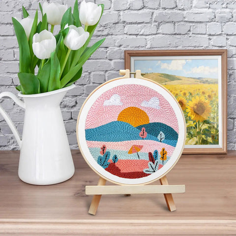 Punch Needle Kit For Adults And Beginners, DIY Landscape Embroidery Set displayed on easel, with flowers and painting.