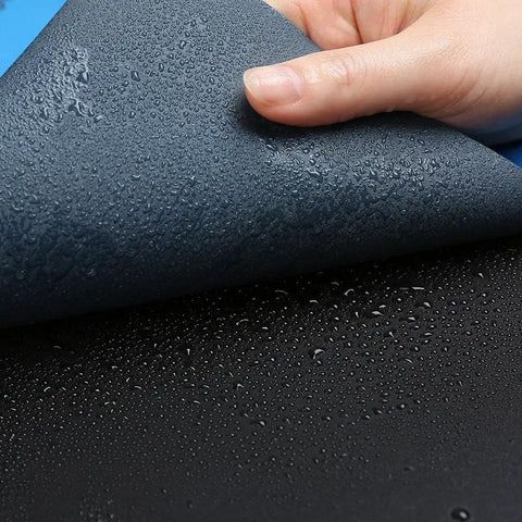 Hand holding 320 Grit Sandpaper Pro Grade 9 By 11 Inches Pack Of 30 Sheets Silicon Carbide for dry and wet sanding, waterproof surface