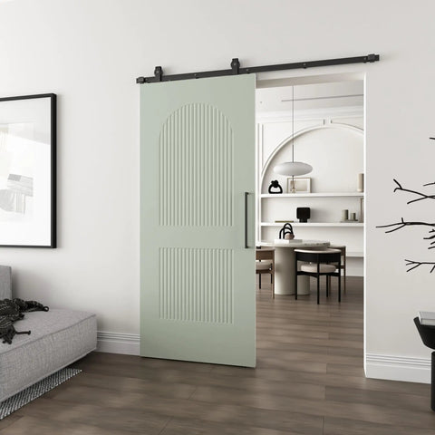 Silky Smooth Two Panel Sliding Barn Door With Reeded Arched White Primed Finish For Modern Farmhouse Room Divider, mint green color in interior.