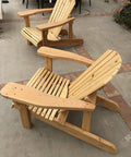 Classic Adirondack Chair Plans With Full Size Templates Total No Sweat Weekend Build For Your Backyard Lounge Easy To Tackle Alone Or With Buddies. Two wooden Adirondack chairs with a slatted design on a patio.