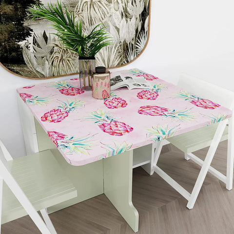 Table covered with Bold Pink Pineapple Peel And Stick Wallpaper With Watercolor Pineapple Pattern, self-adhesive vinyl roll.
