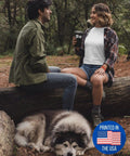Couple in forest with dog, woman holding Funny Ocean Rowing 20 Oz Insulated Tumbler With Lid Black Hilarious Gift For Wife Or Hubby