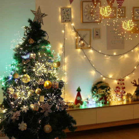 Christmas tree with Lit 4 Pack Firework LED Copper Wire Star String Lights, 8 modes, in festive room decor setting.