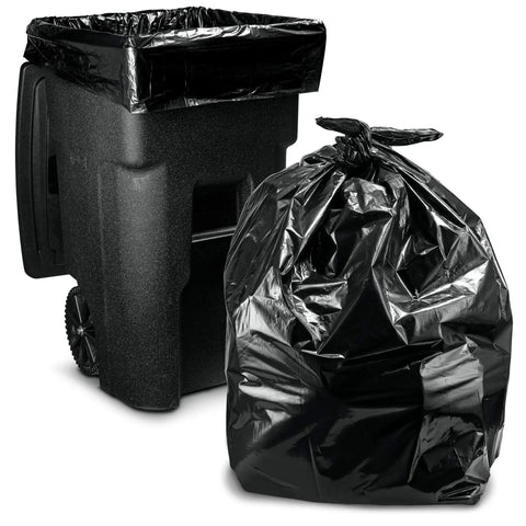 Hella Tough 95 Gallon Contractor Garbage Bags Built Like Armor For Industrial Sites With Easy Tie Necks Top Shelf 2 Mil Trash Can Liners Workhorse Strength Pack Of 25 next to a black trash bin.