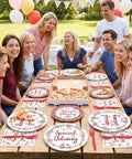 Group enjoying outdoor pizza party with 96 Piece Special Delivery Pizza Paper Plates And Napkins Set Hits Different With Chic Red White Checkered Prints.