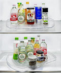 Rotating Lazy Susan Turntable Organizer Rectangular 16.5 Inch By 11.1 Inch in fridge, holding various bottles and jars.