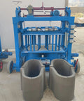 Industrial Brick Making Machine And Cement Block Production Equipment For Workshops Featuring Hella Solid Hydraulics with molded concrete blocks.