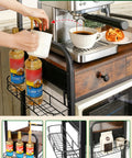 Rolling Coffee Bar Cart On Wheels For Small Spaces With 5-Tier Storage, Syrup Rack and Tea Pod Drawer with cups and bottles.