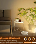 Dope 5W LED Indoor Spotlight Kit With Remote Dimmable And Timer 3 CCT Uplighting illuminating plants next to a bed