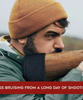 Man using Gel Recoil Pad For Shotgun With Slip On Rifle Stock Pad Softens The Kick Using Visco Elastic Gel on wooden stock.