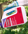 Person applying Insect Control Systemic Granules Ready To Use No Fuss Water Resistant Long Lasting Outdoor Protection
