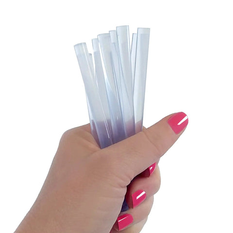 Hand holding 8-Inch Clear Mini Hot Glue Sticks For Crafting And DIY Projects, Multi-Temp Bond, strong hold on various materials
