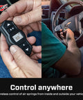 Hands using Wireless Onboard Air Compressor With EZ Mount Bluetooth App Control And LCD Presets Quick Battery Install Compact