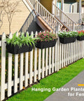 Heavy Duty Black Balcony Rail Planters 16.9 Inch Deck Flower Boxes with flowers on a white fence in a garden setting.