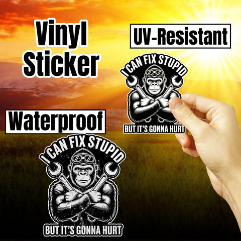 Hand holding 'I Can Fix Stupid But It's Gonna Hurt Mechanic Gorilla Wrench Sticker Set For Water Bottles Skateboards Notebooks Laptops Mugs Phones Cars Durable Vinyl Decals With Bold Humor For Daily Gear' in sunlight