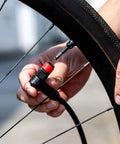 Abs Pro Clik Chuck With Clik Valve Cores Replacement Floor Pump Chuck inflating bike tire on stand with Clik Valve