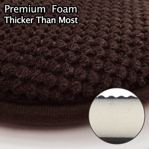Close-up of brown U-shaped foam seat cushion showing thick high density foam layer and textured washable microfiber cover.