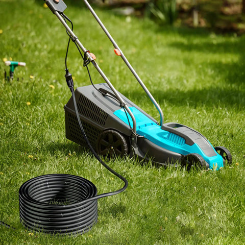 Coiled Long Reach 200ft Heavy Duty Extension Cord 16 AWG 3 Prong SJTW Power Cable connected to electric lawn mower
