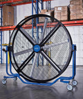 Hardcore 8 Foot Mobile Industrial Cooling Barrel Fan With Six Aluminum Blades And Variable Speed EC Motor cranking out 65000 CFM airflow in warehouse.