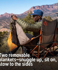 Two people sitting on Two Person Camping Chair With Removable Blankets Low To The Ground Loveseat Nest in nature