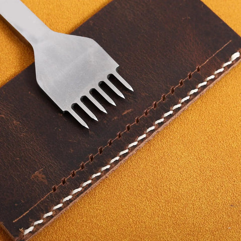 Leather Stitching Punch Kit With White Steel Prongs 5mm Pitch 6 prong tool on stitched leather piece