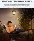 Woman reading under outdoor lighting with Dusk To Dawn Sensor LED Bulbs 6W A19 Outdoor Lighting 500 Lumens 2700K Warm White Auto On Off Photocell E26