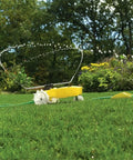 Traveling Sprinkler That Rolls Across Large Lawns Up To 13,500 Sq Ft Cast Iron Outdoor Water Sprinkler For Yard And Garden With Auto Shut Off And Adjustable Spray Arms In Bright Yellow.