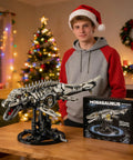 Teen with Myth Qholve Mechanical Mosasaurus Building Block Set on display stand, holiday decorations in background.