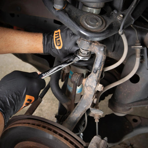 Mechanic using 16 Piece Reversible Ratcheting Combination Wrench Set Metric With Flush Mounted Reversing Lever for car repair