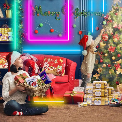 Festive living room with family in Santa hats, decorated Christmas tree, gifts, and neon Merry Christmas sign on the wall.