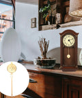 Metal Clock Pendulum Replacement Part 8.27 By 2.36 Inch displayed with wooden wall clock on a vintage shelf setting