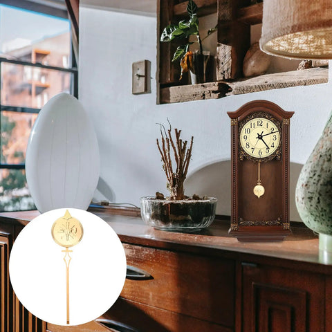 Metal Clock Pendulum Replacement Part 8.27 By 2.36 Inch displayed with wooden wall clock on a vintage shelf setting
