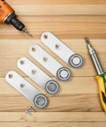 Four Piece One Point Six Inch Rubber Sliding Door Rollers That Glide Smooth As Silk With Precision Bearings Built For Barn Closets And Side Track Wardrobe Systems on wood surface with tools.