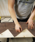 Person using DIY Friendly Stair Stringer Cutting Layout Tool Four Step Guide To Measure Calculate Mark And Cut on lumber