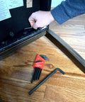 Person using Long Series Hex L Key Allen Wrench Set 13 Piece SAE Inch Sizes From.050 To 3 Eighths Made In USA on wooden furniture