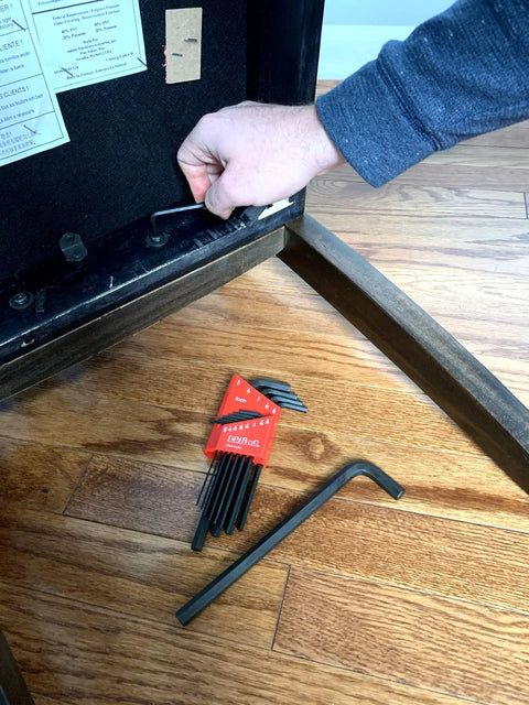Person using Long Series Hex L Key Allen Wrench Set 13 Piece SAE Inch Sizes From.050 To 3 Eighths Made In USA on wooden furniture