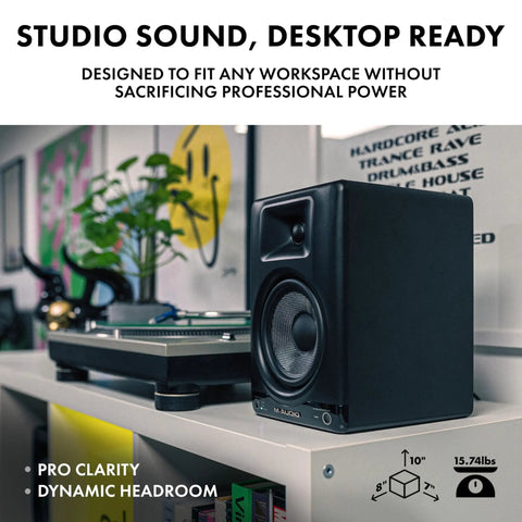 BX5BT 5 Inch Desktop Studio Monitor Speaker on desk with turntable, showcasing DSP and Bluetooth app control, ideal for small rooms.