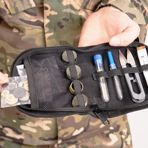Person holding a Survival Sewing Kit For Home And Outdoors Grab And Go Nylon Case With Zipper All In One Repair Tools.